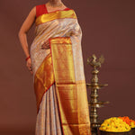 Beige Kanjivaram Tissue Saree With Contrast Red Border