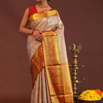 Beige Kanjivaram Tissue Saree With Contrast Red Border