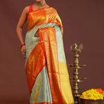 Pistachio Green Kanjivaram Tissue Saree With Contrast Orange Border