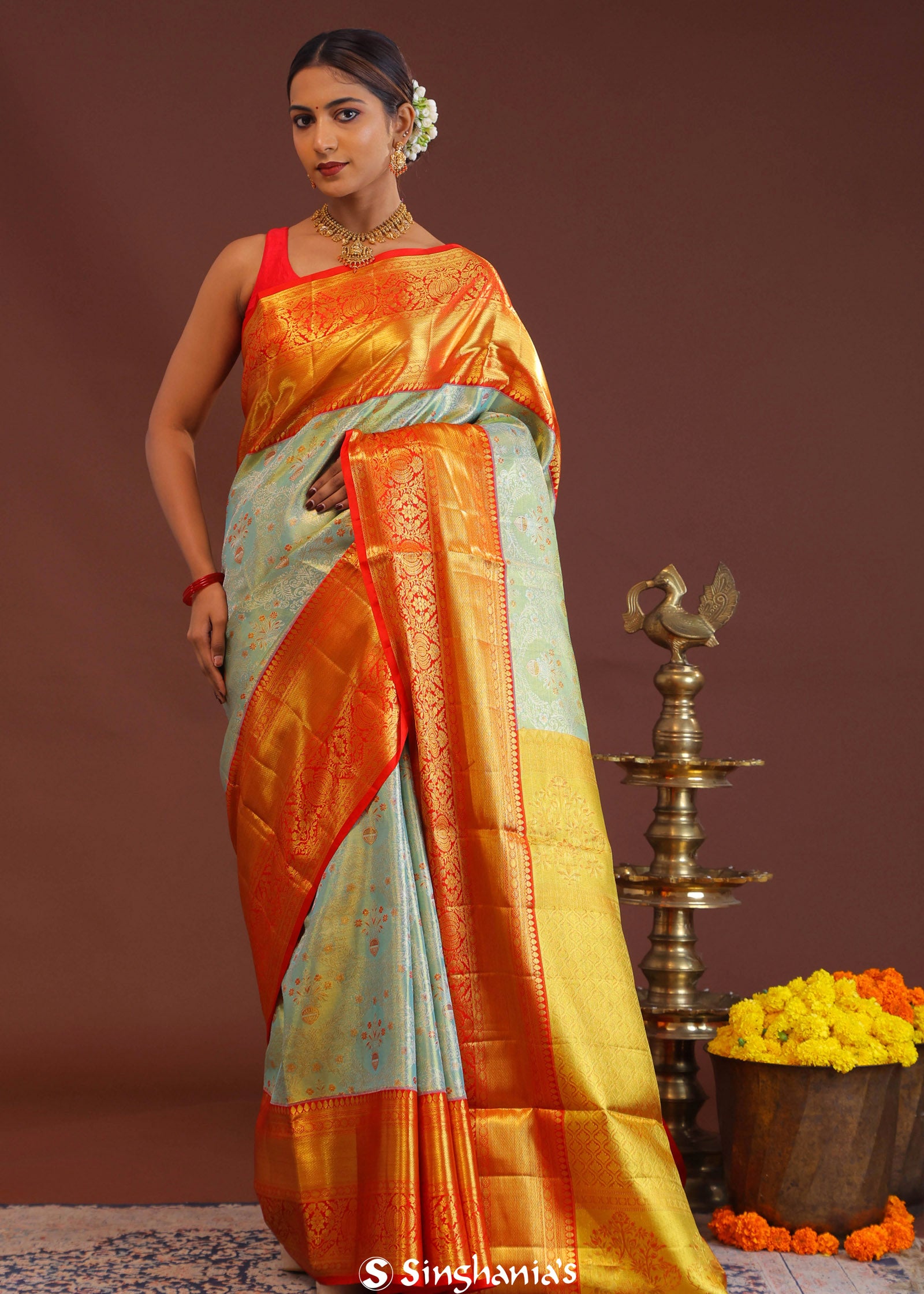 Pistachio Green Kanjivaram Tissue Saree With Contrast Orange Border