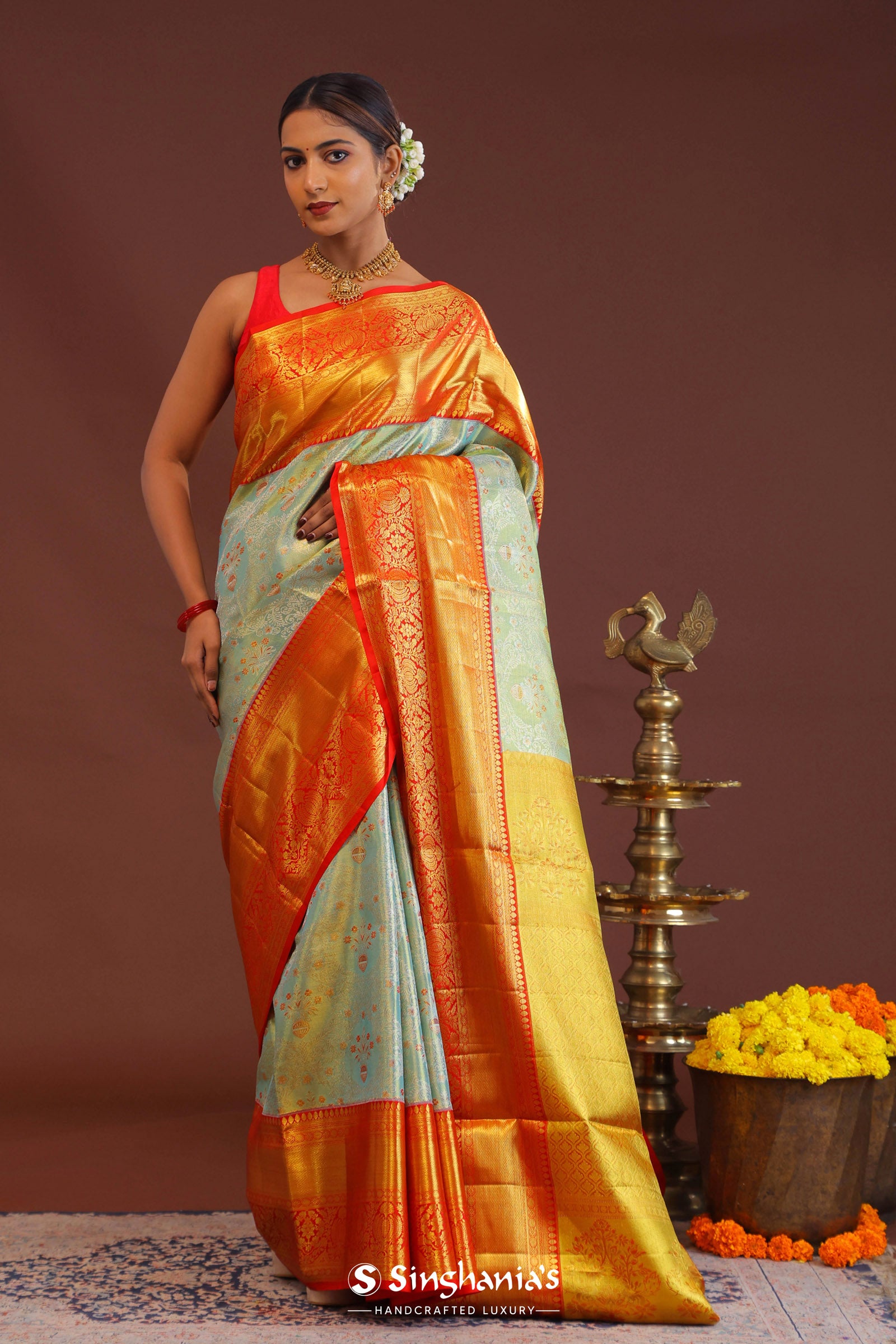 Pistachio Green Kanjivaram Tissue Saree With Contrast Orange Border