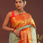 Pistachio Green Kanjivaram Tissue Saree With Contrast Orange Border