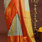 Pistachio Green Kanjivaram Tissue Saree With Contrast Orange Border