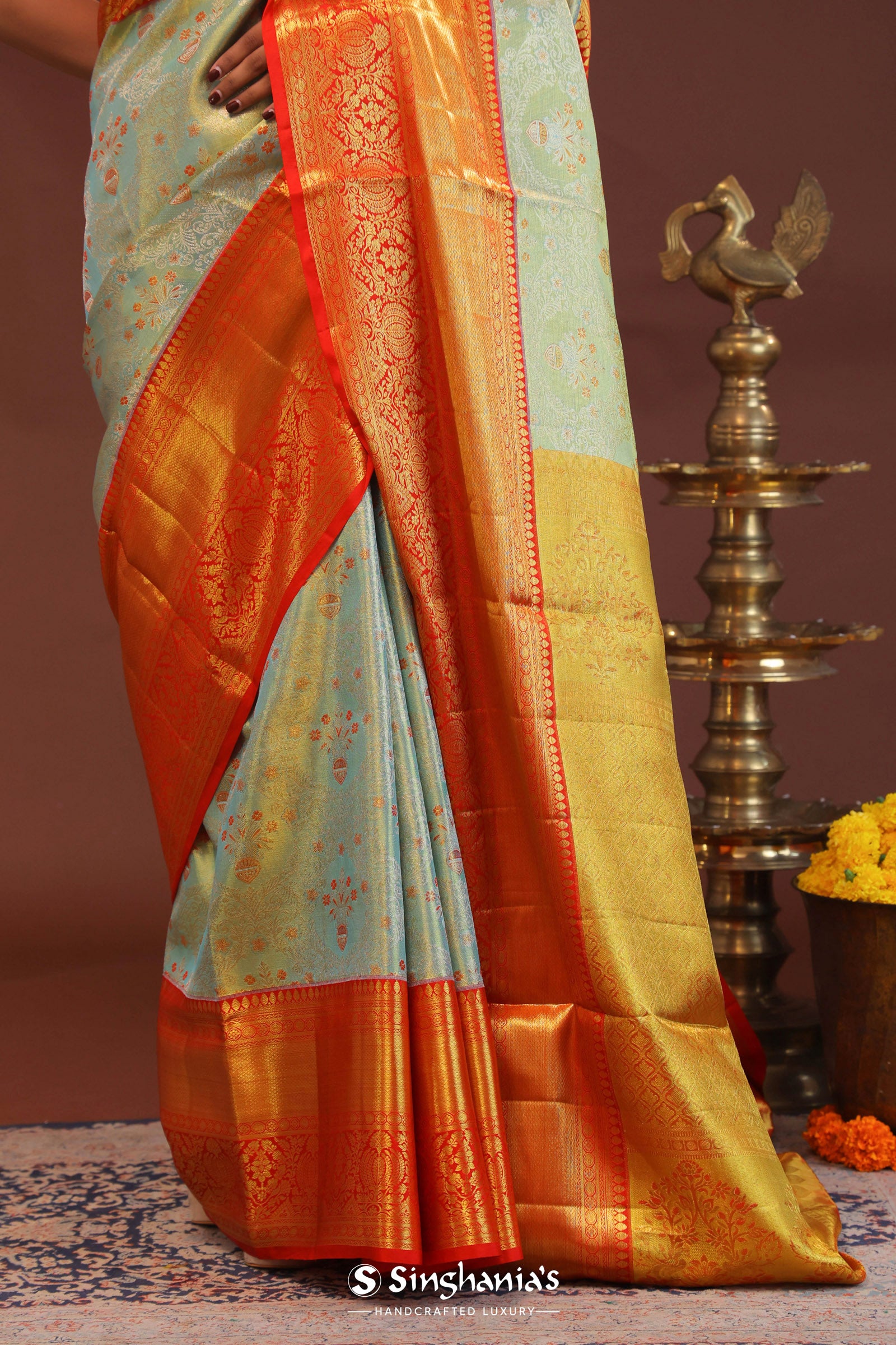 Pistachio Green Kanjivaram Tissue Saree With Contrast Orange Border