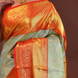 Pistachio Green Kanjivaram Tissue Saree With Contrast Orange Border