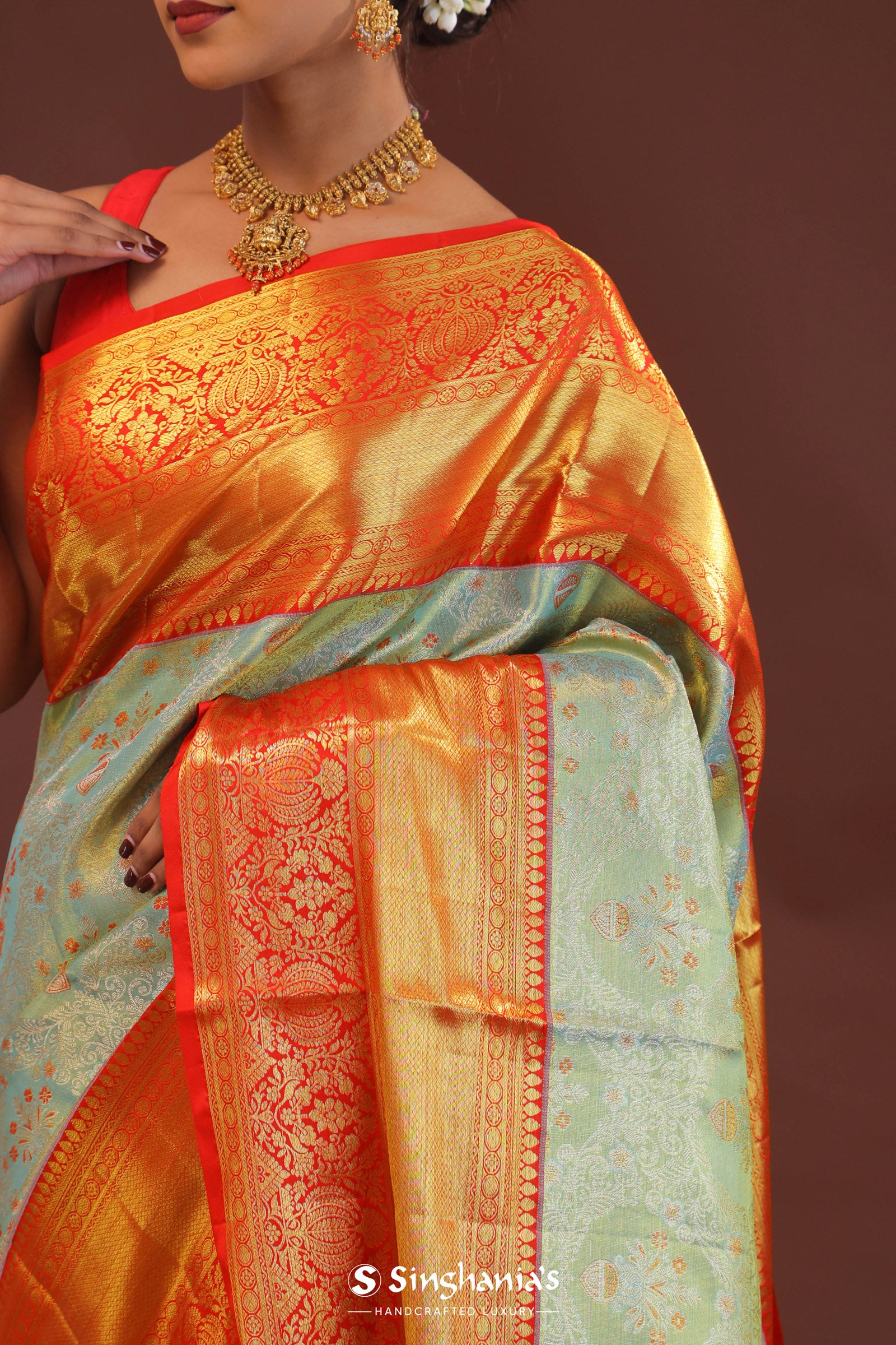 Pistachio Green Kanjivaram Tissue Saree With Contrast Orange Border