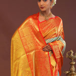 Pistachio Green Kanjivaram Tissue Saree With Contrast Orange Border