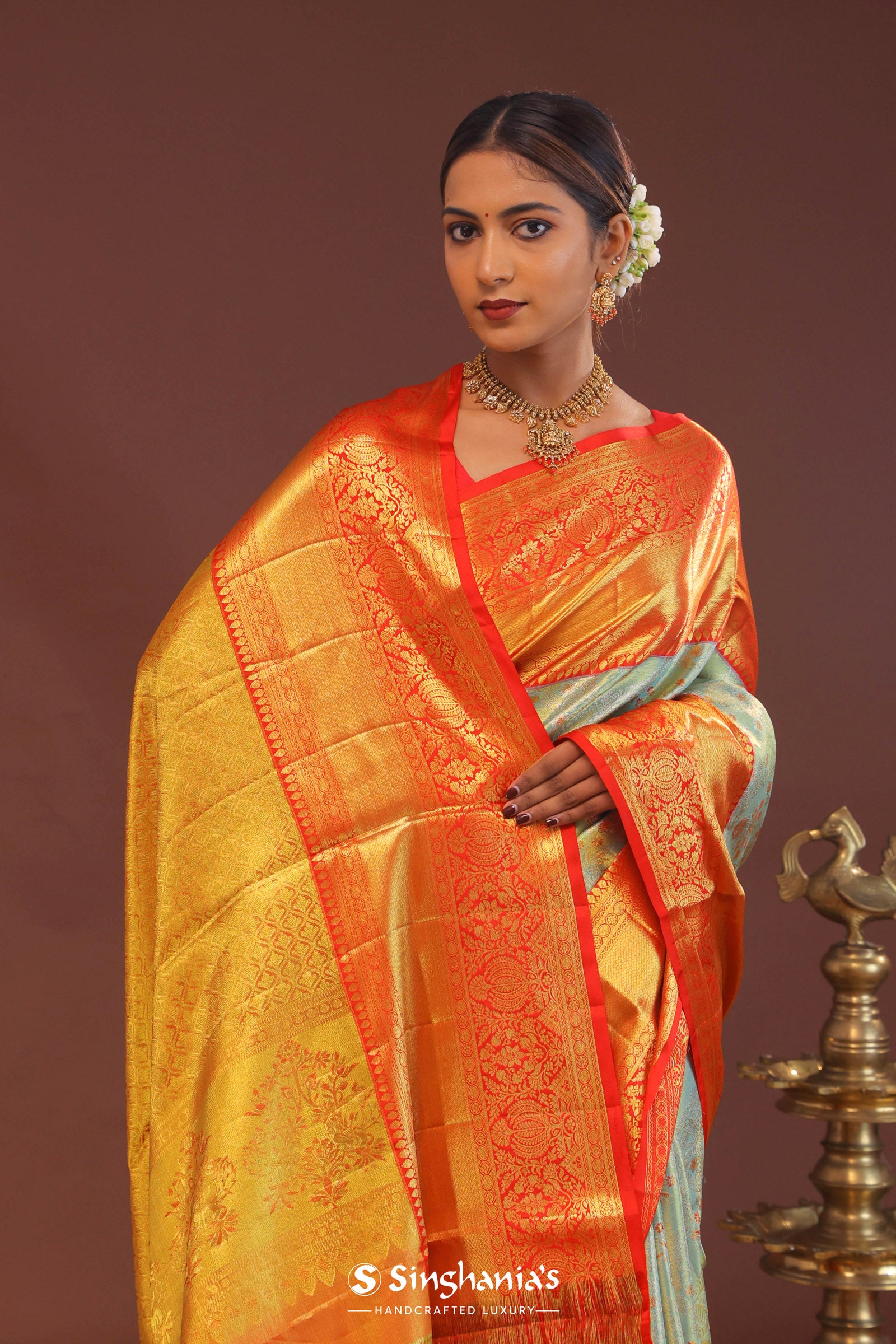 Pistachio Green Kanjivaram Tissue Saree With Contrast Orange Border