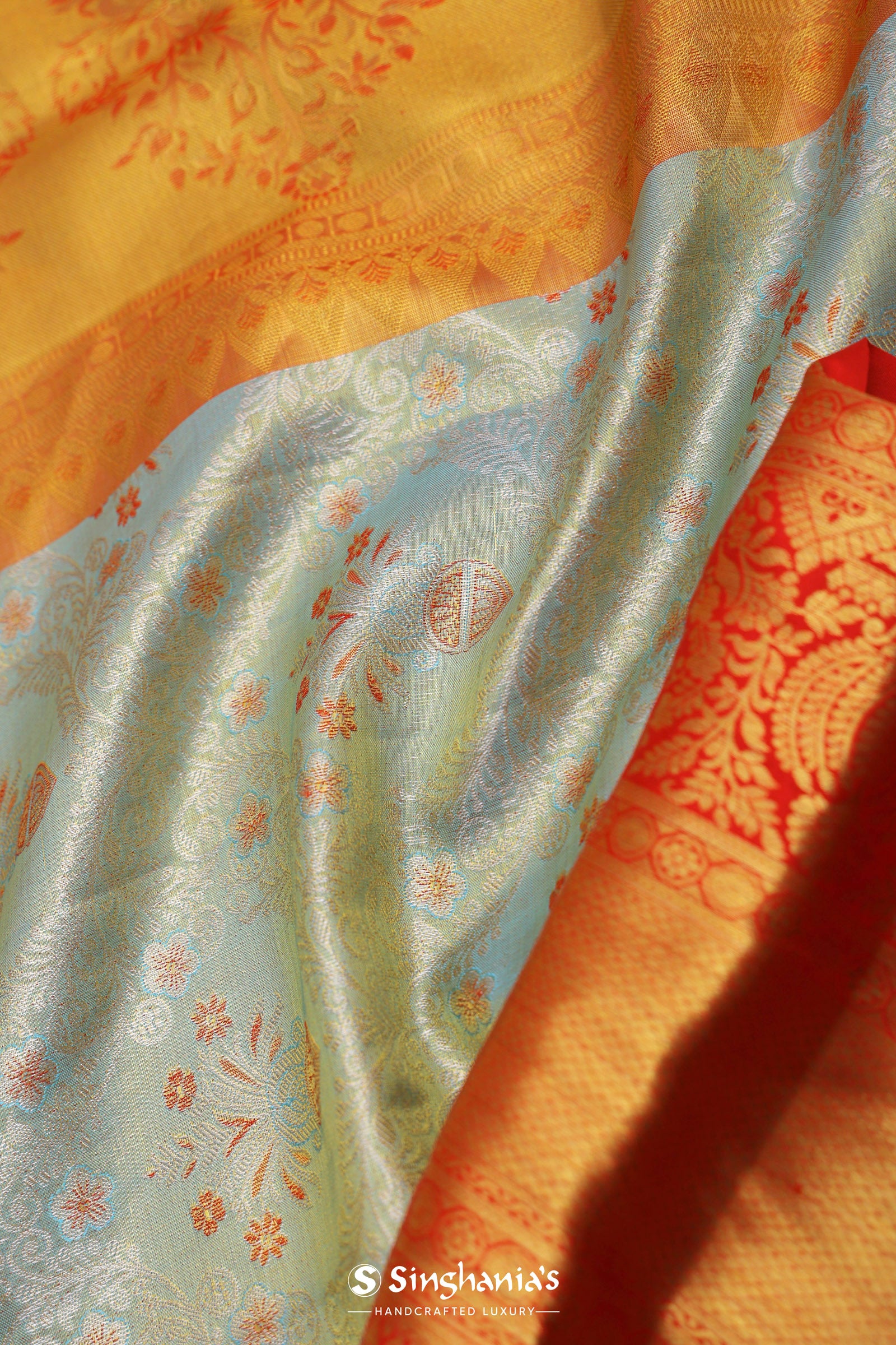 Pistachio Green Kanjivaram Tissue Saree With Contrast Orange Border