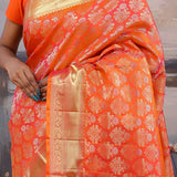 Vibrant Orange Kanjivaram Saree With Floral Design