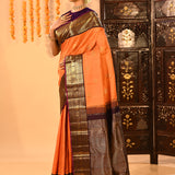 Apricot Orange Kanjivaram Silk Saree With Purple Contrast Zari Border