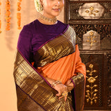 Apricot Orange Kanjivaram Silk Saree With Purple Contrast Zari Border