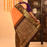 Apricot Orange Kanjivaram Silk Saree With Purple Contrast Zari Border