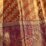 Captivating Rust Orange And Purple Kanjivaram Silk Saree With Peacock And Vine Motifs