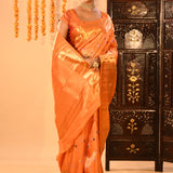 Vibrant Orange With Colourful Buttis And Broad Gold Zari Border In Kanjivaram Silk Saree