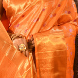 Vibrant Orange With Colourful Buttis And Broad Gold Zari Border In Kanjivaram Silk Saree