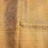 Gold Dual Tone Zari Floral Butti Pure Silk Kanjivaram Saree With Contrast Orange Border