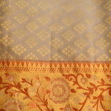 Silver Grey Kanjivaram Silk Saree With Self Tone Gold Zari Floral Weave And Contrast Orange Gold Jaal Border
