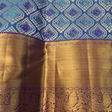 Teal & Royal Purple Kanjivaram Silk Saree With Silver Floral Jaal Body & Gold Yazhi Border