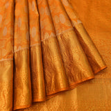 Burnt Orange Kanjivaram Silk Saree With Silver Lotus Buttas & Self Gold Paisley Zari Pallu