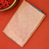 Kanjivaram Silk Saree In Peach With Silver Zari Floral Jaal And Contrast Teal Paisley Border