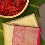 Beige Kanjivaram Silk Saree With Pink Border And Gold Zari Floral Weave