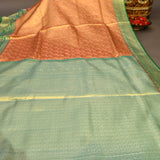Rust Orange Kanjivaram Silk Saree With Green Border And Gold Zari Lotus Weave