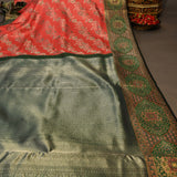 Kanjivaram Silk Saree In Coral Red With Silver Zari Floral Jaal And Contrast Deep Green Gold Medallion Border