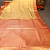 Beige Kanjivaram Silk Saree With Red Contrast Border And Gold Zari Floral Weave
