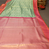 Sea Green Kanjivaram Silk Saree With Orange-Red Border And Gold Zari Paisley Weave