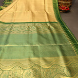 Graceful Metallic Beige And Green Kanjivaram Silk Saree With Gold Zari Peacock Motifs