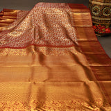 Rust Orange Kanjivaram Silk Saree With Maroon Border And Gold Zari Paisley Weave