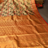Orange Kanjivaram Silk Saree With Multicolor Floral Pallu And Red Zari Border