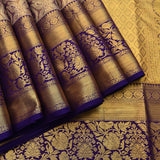 Gold Kanjivaram Silk Saree With Navy Blue Contrast Border And Multicolour Floral Medallion Weave