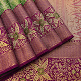 Green Kanjivaram Silk Saree With Purple Lotus Motif Border