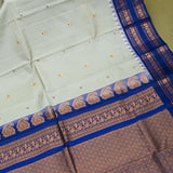 Elegant Cream And Royal Blue Gadwal Pattu Saree With Traditional Paisley Border