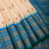 Cream Gadwal Pattu Silk Saree With Peacock Blue Border