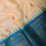 Cream Gadwal Pattu Silk Saree With Peacock Blue Border