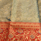Sage Green Kanjivaram Silk Saree With Red Border And Multicolour Floral Weave