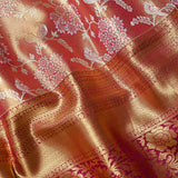Rust Orange Kanjivaram Silk Saree With Silver Floral Bird Motifs And Magenta Gold Zari Border