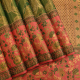 Striking Forest Green And Coral Pink Kanjivaram Silk Saree With Peacock Motifs