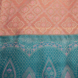 Kanjivaram Silk Saree In Peach With Silver Zari Floral Jaal And Contrast Teal Paisley Border