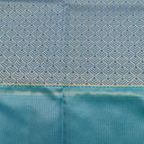 Kanjivaram Silk Saree In Peach With Silver Zari Floral Jaal And Contrast Teal Paisley Border