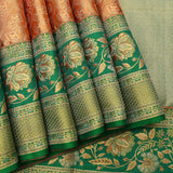 Rust Orange Kanjivaram Silk Saree With Green Border And Gold Zari Lotus Weave