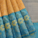 Mustard Yellow Kanjivaram Silk Saree With Teal Border And Multicolour Floral Weave