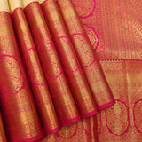 Timeless Cream And Rani Pink Kanjivaram Silk Saree With Gold Zari Motifs