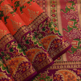Kanjivaram Silk Saree In Orange Red With Elephant Shikargah And Contrast Purple Multicolour Paisley Border