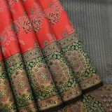 Kanjivaram Silk Saree In Coral Red With Silver Zari Floral Jaal And Contrast Deep Green Gold Medallion Border