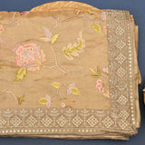 Elegant Beige Organza Tissue Saree With Hand-Embroidered Roses & Gold Border