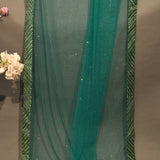 Emerald Green Net Designer Saree With Shimmer Highlights And Striped Sequin Border